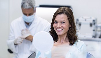 patient smiling after getting dental implants in Eatontown