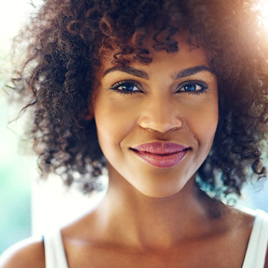 Closeup of youthful woman smiling