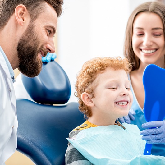 Child smiling at the dentist