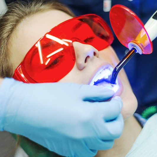 Woman receiving cosmetic dental bonding treatment