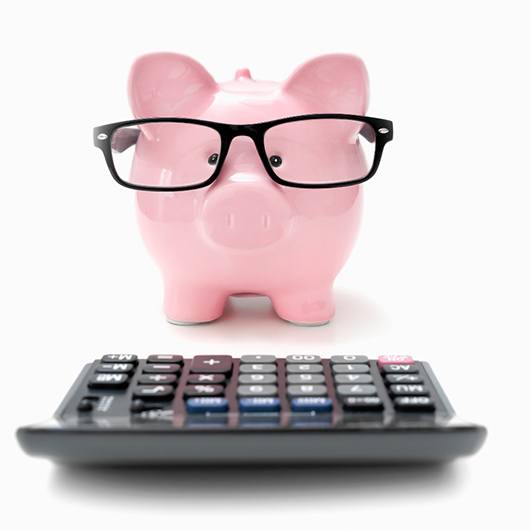 piggy bank and calculator for cost of cosmetic dentistry in Eatontown 
