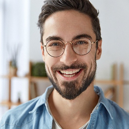 man smiling with dental bridge in Eatontown