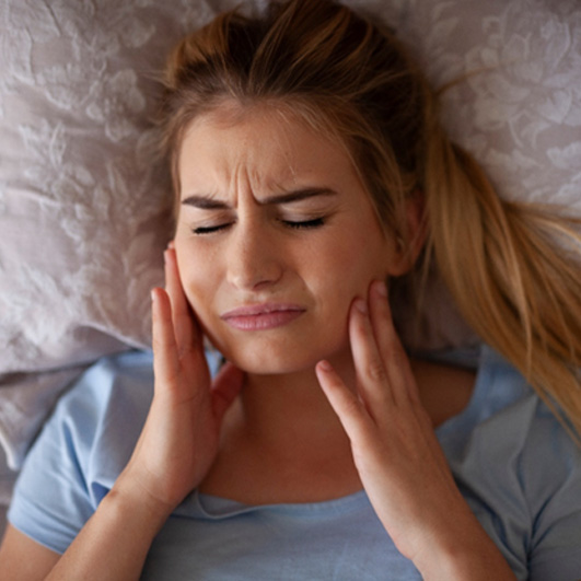 Teeth grinding is a condition that occurs when you clench your jaw or grind your teeth into each other while you sleep
