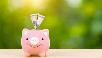 piggy bank representing cost of Invisalign in Eatontown