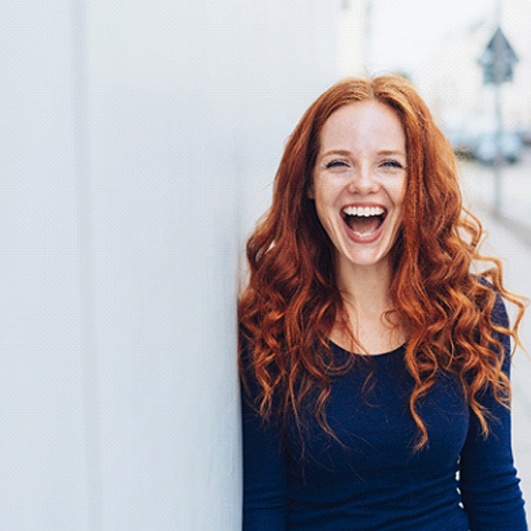 Closeup of woman with Juvéderm in Eatontown smiling outside