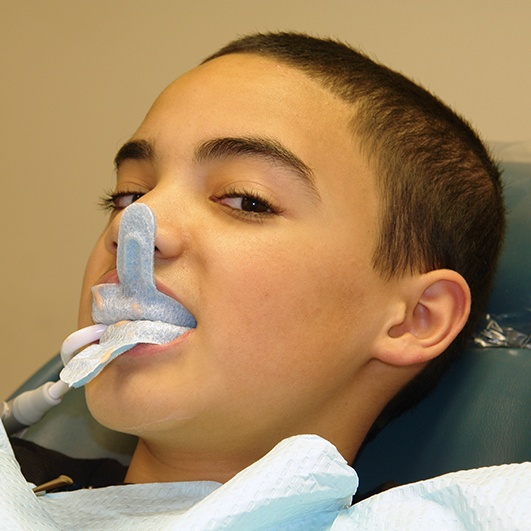 Child receiving fluoride treatment