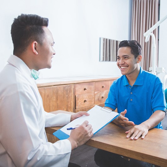 patient talking to dentist 