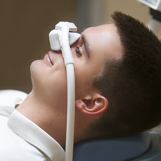 Patient receiving nitrous oxide dental sedation pill