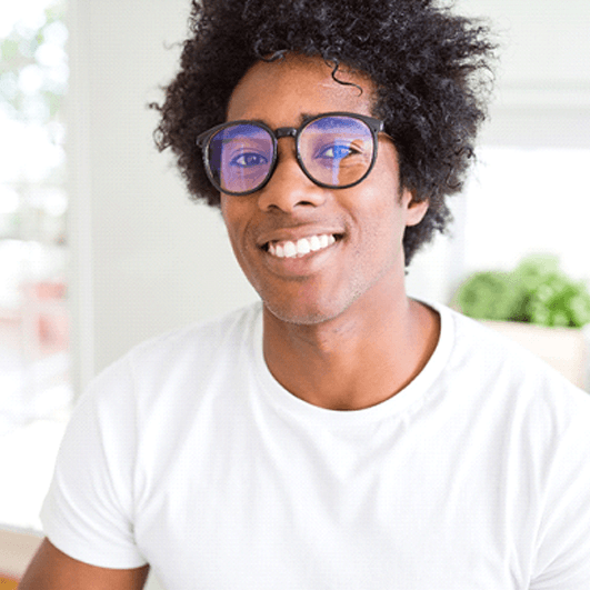 a man smiling after teeth whitening in Eatontown