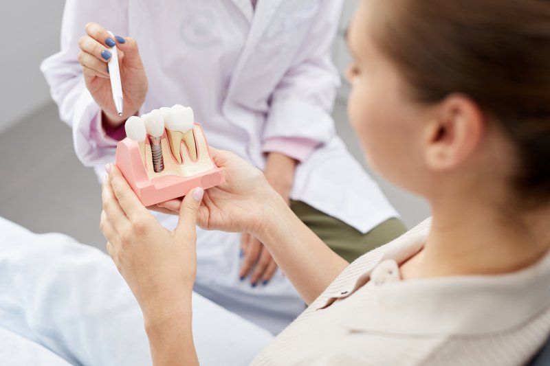 a patient and dentist discussing dental implants in Eatontown