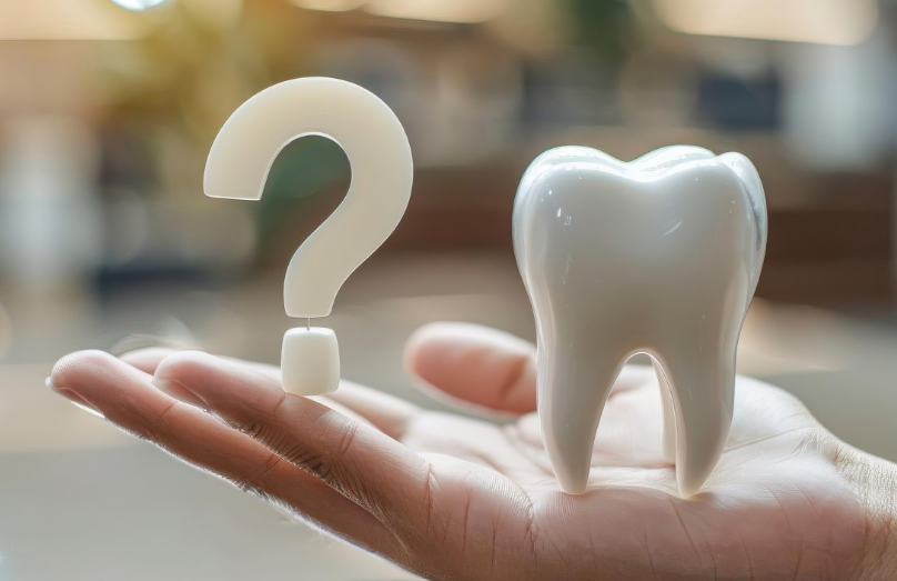 3D image of a question mark and a tooth