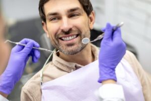 Man smiling at his dental checkup