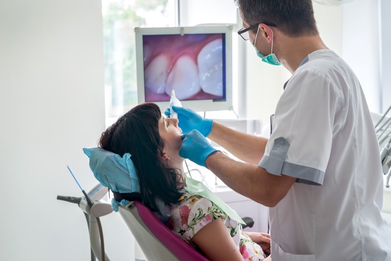 Patient talking to dentist about oral health